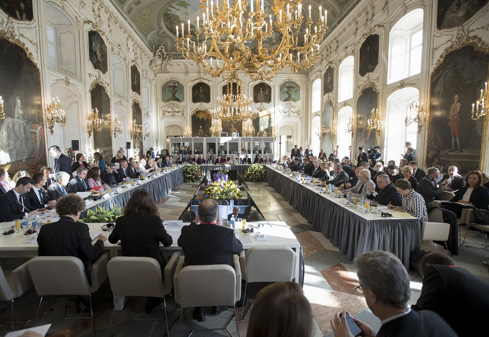 a group of people sitting at tables