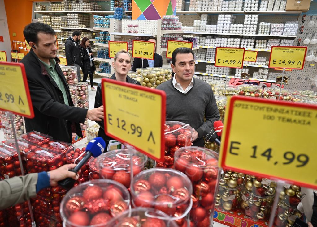 Kostas Skrekas et al. holding signs